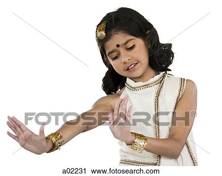 Girl (8-9) wearing traditional sari performing figures from indian traditional dance, studio shot View Large Photo Image Stock Image - Girl (8-9) wearing traditional sari performing figures from indian traditional dance, studio shot. Fotosearch