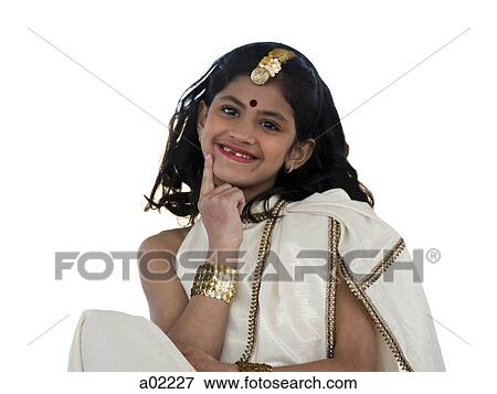 Girl (8-9) wearing traditional sari, smiling, portrait, studio-shot View Large Photo Image Stock Photo - Girl (8-9) wearing traditional sari, smiling, portrait, studio-shot. Fotosearch