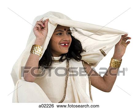 Girl (8-9) wearing traditional sari, portrait, studio-shot View Large Photo Image Stock Photograph - Girl (8-9) wearing traditional sari, portrait, studio-shot. Fotosearch