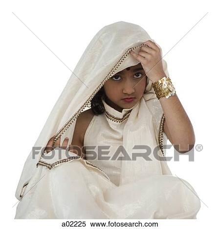 Girl (8-9) wearing traditional sari, portrait, studio-shot View Large Photo Image Stock Photography - Girl (8-9) wearing traditional sari, portrait, studio-shot. Fotosearch