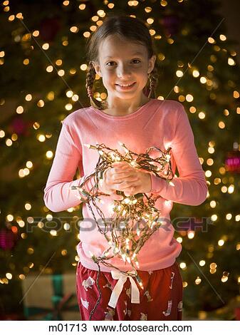 Stock Image - girl at christmas. Fotosearch