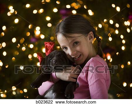 girl getting a puppy for christmas View Large Photo Image Stock Image - girl getting a puppy for christmas. Fotosearch
