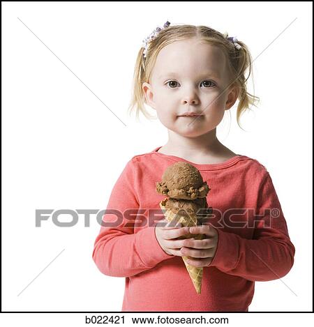 Stock Image - girl holding an ice cream cone. Fotosearch