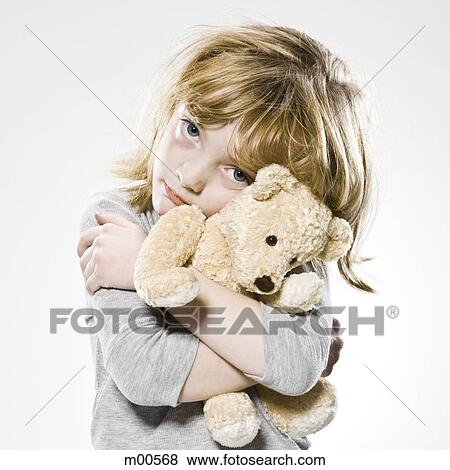girl hugging her teddy bear View Large Photo Image Stock Photo - girl hugging her teddy bear. Fotosearch