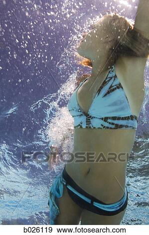 girl in a swimming pool View Large Photo Image Stock Photo - girl in a swimming pool. Fotosearch