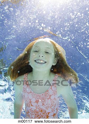 girl in a swimming pool View Large Photo Image Stock Photo - girl in a swimming pool. Fotosearch