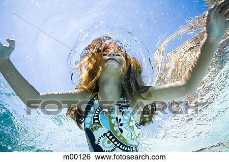 Stock Photograph - girl in a swimming pool. Fotosearch