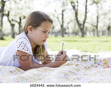girl lying on a blanket View Large Photo Image Stock Photography - girl lying on a blanket. Fotosearch