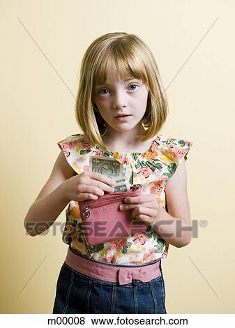 girl putting money into her purse View Large Photo Image Stock Photo - girl putting money into her purse. Fotosearch