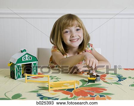 girl sitting at the kitchen table View Large Photo Image Stock Image - girl sitting at the kitchen table. Fotosearch