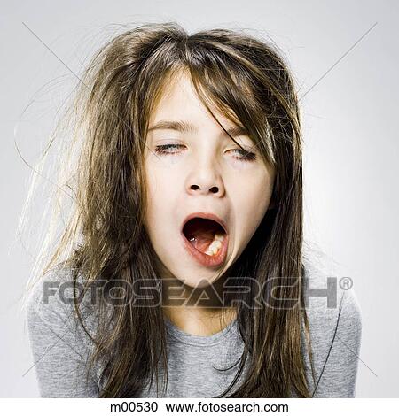 Stock Image - girl waking up in the morning. Fotosearch