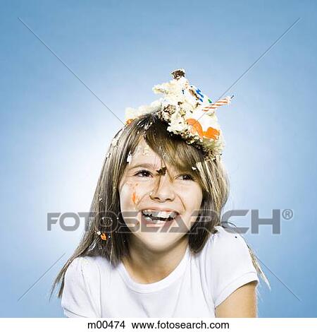 girl with birthday cake on her head View Large Photo Image Picture - girl with birthday cake on her head. Fotosearch
