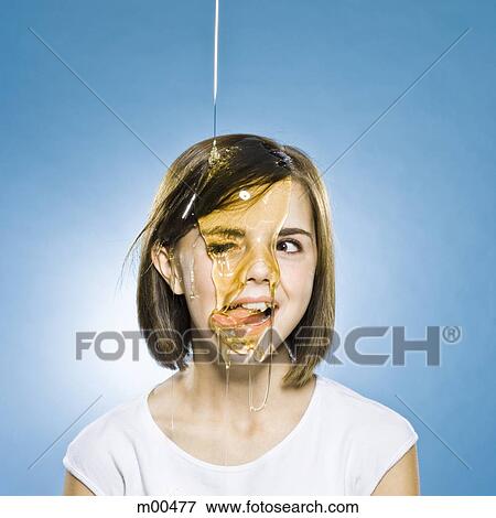 girl with honey pouring on her head View Large Photo Image Stock Photo - girl with honey pouring on her head. Fotosearch