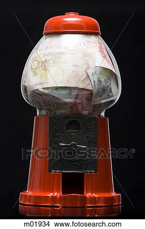 Picture - gumball machine full of money. Fotosearch