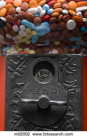 Stock Image - gumball machine full of pills. Fotosearch