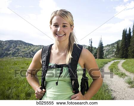 Stock Photography - hiker on a mountain path. Fotosearch