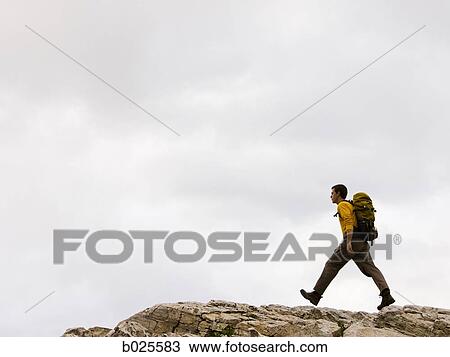 Stock Image - hiker on a ridge. Fotosearch