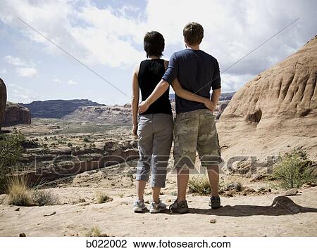Stock Image - hikers in the desert. Fotosearch