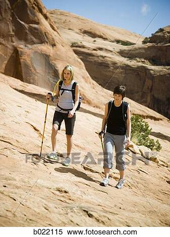 Stock Photography - hikers in the desert. Fotosearch