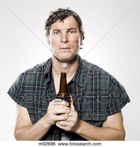 Stock Photograph - homeless man holding a beer bottle. Fotosearch