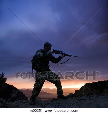hunter against a sunset View Large Photo Image Stock Image - hunter against a sunset. Fotosearch