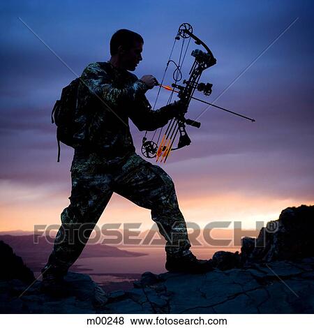 hunter against a sunset View Large Photo Image Stock Photo - hunter against a sunset. Fotosearch