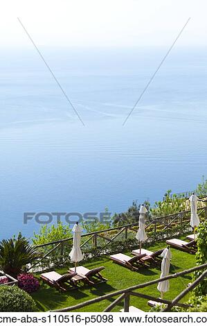 Italy, Amalfi Coast, Ravello, High angle view of lounge chairs with view on sea View Large Photo Image Stock Photo - Italy, Amalfi Coast, Ravello, High angle view of lounge chairs with view on sea . Fotosearch