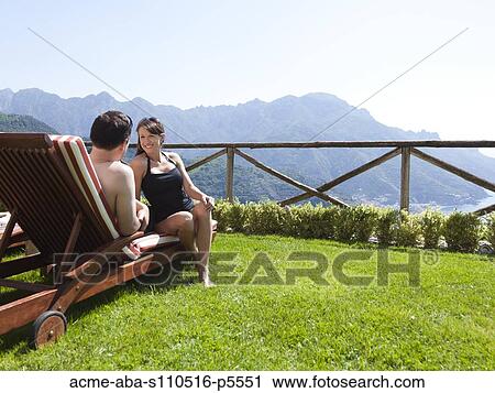 Italy, Amalfi Coast, Ravello, Mature couple sitting on lounge chair View Large Photo Image Stock Image - Italy, Amalfi Coast, Ravello, Mature couple sitting on lounge chair. Fotosearch