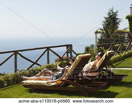 Italy, Amalfi Coast, Ravello, Mature couple lying on lounge chair View Large Photo Image Stock Image - Italy, Amalfi Coast, Ravello, Mature couple lying on lounge chair. Fotosearch