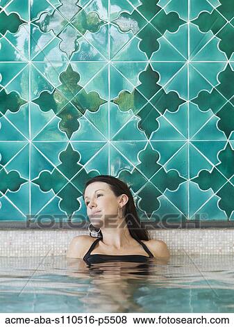 Italy, Amalfi Coast, Ravello, Mature woman in swimming pool looking away View Large Photo Image Stock Photo - Italy, Amalfi Coast, Ravello, Mature woman in swimming pool looking away. Fotosearch