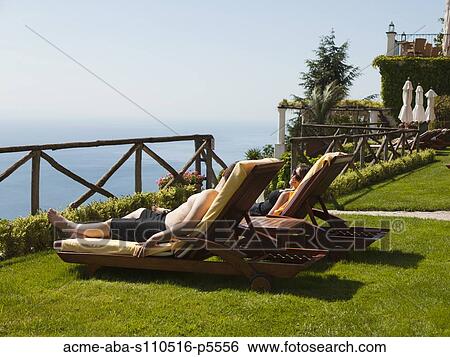 Italy, Amalfi Coast, Ravello, Mature couple lying on lounge chairs View Large Photo Image Stock Photograph - Italy, Amalfi Coast, Ravello, Mature couple lying on lounge chairs. Fotosearch
