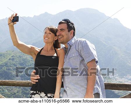 Italy, Amalfi Coast, Ravello, Smiling mature couple taking self photo View Large Photo Image Stock Photograph - Italy, Amalfi Coast, Ravello, Smiling mature couple taking self photo. Fotosearch