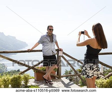Italy, Amalfi Coast, Ravello, Woman taking picture of men View Large Photo Image Stock Photo - Italy, Amalfi Coast, Ravello, Woman taking picture of men. Fotosearch