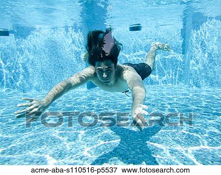 Italy, Amalfi Coast, Ravello, Young man swimming underwater View Large Photo Image Stock Photo - Italy, Amalfi Coast, Ravello, Young man swimming underwater. Fotosearch