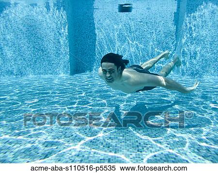 Italy, Amalfi Coast, Ravello, Young man swimming underwater View Large Photo Image Stock Photography - Italy, Amalfi Coast, Ravello, Young man swimming underwater. Fotosearch