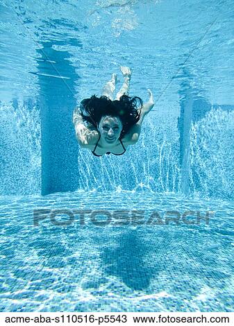 Italy, Amalfi Coast, Ravello, Young woman swimming underwater, front view View Large Photo Image Stock Image - Italy, Amalfi Coast, Ravello, Young woman swimming underwater, front view. Fotosearch