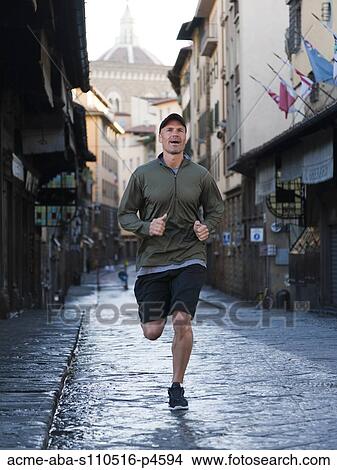 Italy, Florence, Man jogging in city View Large Photo Image Picture - Italy, Florence, Man jogging in city. Fotosearch