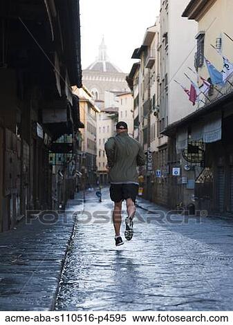 Italy, Florence, Man jogging in city View Large Photo Image Stock Photography - Italy, Florence, Man jogging in city. Fotosearch