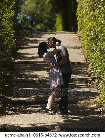 Italy, Florence, Romantic couple kissing in treelined alley View Large Photo Image Stock Image - Italy, Florence, Romantic couple kissing in treelined alley. Fotosearch