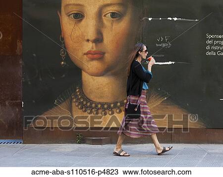 Italy, Florence, Young woman walking past portrait in city View Large Photo Image Stock Image - Italy, Florence, Young woman walking past portrait in city. Fotosearch