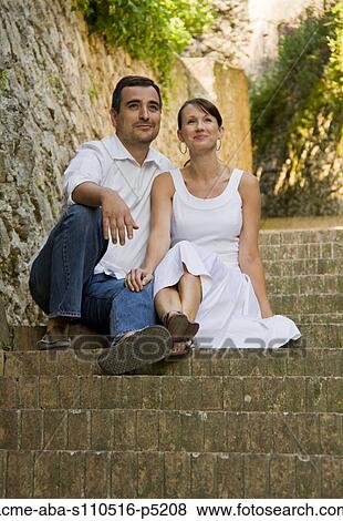 Italy, Ravello, Couple sitting on steps in old town View Large Photo Image Stock Photo - Italy, Ravello, Couple sitting on steps in old town. Fotosearch
