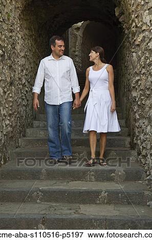 Italy, Ravello, Couple walking on stairs View Large Photo Image Stock Photo - Italy, Ravello, Couple walking on stairs. Fotosearch