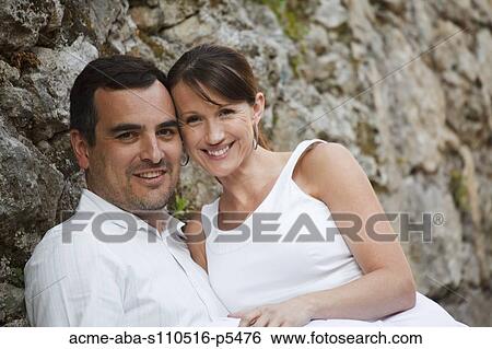 Italy, Ravello, Mature couple embracing against stone wall View Large Photo Image Stock Photograph - Italy, Ravello, Mature couple embracing against stone wall. Fotosearch