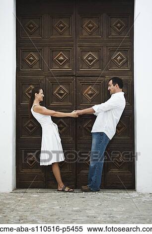 Stock Photography - Italy, Ravello, Mature couple standing in front of historic gate. Fotosearch