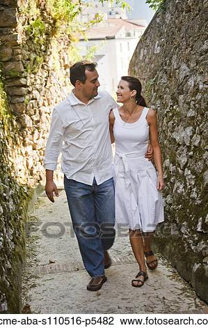 Italy, Ravello, Mature couple walking along narrow lane View Large Photo Image Stock Image - Italy, Ravello, Mature couple walking along narrow lane. Fotosearch