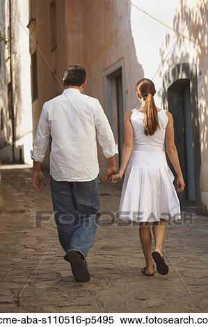 Italy, Ravello, Mature couple walking along narrow lane View Large Photo Image Stock Photography - Italy, Ravello, Mature couple walking along narrow lane. Fotosearch