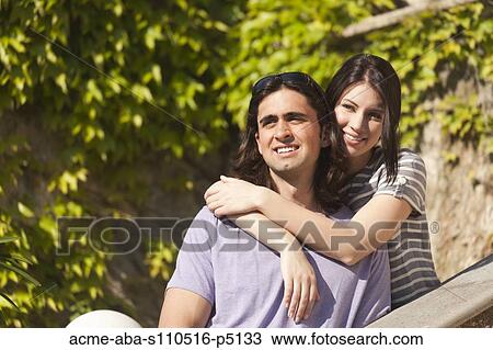 Italy, Ravello, Portrait of young couple embracing View Large Photo Image Stock Image - Italy, Ravello, Portrait of young couple embracing. Fotosearch