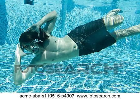 Stock Photo - Italy, Ravello, Underwater portrait of swimming man. Fotosearch