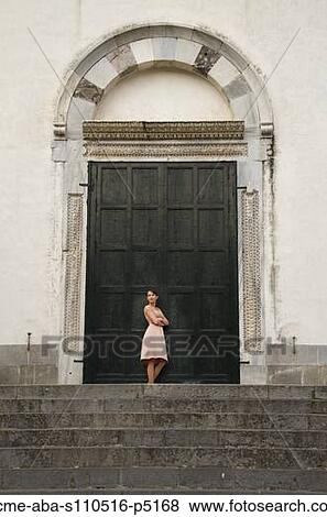 Italy, Ravello, Woman standing in front of closed doors View Large Photo Image Stock Photo - Italy, Ravello, Woman standing in front of closed doors. Fotosearch