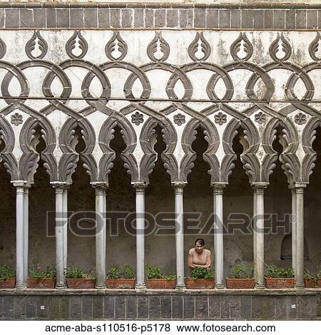 Italy, Ravello, Woman standing on balcony between ornate columns View Large Photo Image Stock Photo - Italy, Ravello, Woman standing on balcony between ornate columns. Fotosearch